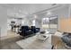 Open-concept living room with plenty of natural light and modern furnishings at 4574 Walden St, Denver, CO 80249