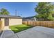 Private backyard with detached garage, patio, and grassy area at 3916 N Mariposa St, Denver, CO 80211