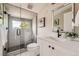 Elegant bathroom with a walk-in shower, marble tile, and a modern vanity at 3916 N Mariposa St, Denver, CO 80211