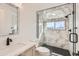 Contemporary bathroom with a frameless shower, marble tile, and black accents at 3916 N Mariposa St, Denver, CO 80211