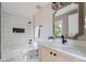 Updated bathroom with a vanity, toilet and shower/tub combo at 3916 N Mariposa St, Denver, CO 80211