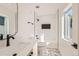 Modern bathroom with white subway tiles, a soaking tub, and black fixtures at 3916 N Mariposa St, Denver, CO 80211