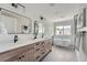 Elegant bathroom with double vanity, soaking tub, and walk-in shower at 3916 N Mariposa St, Denver, CO 80211