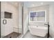 Modern bathroom with walk-in shower and soaking tub at 3916 N Mariposa St, Denver, CO 80211