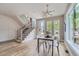 Light and airy dining area with hardwood floors and a modern chandelier at 3916 N Mariposa St, Denver, CO 80211