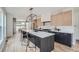 Spacious kitchen with island, stainless steel appliances, and light wood cabinets at 3916 N Mariposa St, Denver, CO 80211