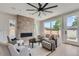 Cozy living room with a brick fireplace and sliding glass doors at 3916 N Mariposa St, Denver, CO 80211