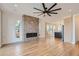 Open living space featuring a herringbone brick fireplace at 3916 N Mariposa St, Denver, CO 80211