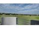 Balcony overlooking scenic neighborhood views with a rail and structural partition at 7330 Centennial Dr, Parker, CO 80138