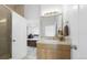 Bright bathroom with a single vanity and a walk in shower at 7330 Centennial Dr, Parker, CO 80138