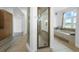Bright bathroom featuring a separate shower, bathtub, and ample natural light from the window at 7330 Centennial Dr, Parker, CO 80138