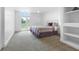 Bedroom with a carpeted floor, walk-out patio, and comfortable bed with natural light at 7330 Centennial Dr, Parker, CO 80138
