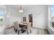 Formal dining room with wood flooring, modern lighting, and seating for six at 7330 Centennial Dr, Parker, CO 80138