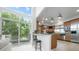 Open kitchen with breakfast bar, stainless steel appliances, and sliding door to deck at 7330 Centennial Dr, Parker, CO 80138