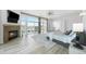 Spacious main bedroom featuring a fireplace, exterior patio, and hardwood flooring at 7330 Centennial Dr, Parker, CO 80138