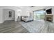 Large main bedroom with a fireplace, an ensuite bathroom, and sliding glass doors to the outside at 7330 Centennial Dr, Parker, CO 80138