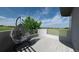 Inviting patio featuring a comfortable hanging chair and a scenic view of the open landscape at 7330 Centennial Dr, Parker, CO 80138
