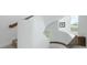 Modern staircase with curved design and natural light at 7330 Centennial Dr, Parker, CO 80138