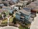 Aerial view of a house with solar panels, a fenced yard, hot tub, and an outdoor seating area at 3368 Cranston Cir, Highlands Ranch, CO 80126