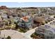 Aerial view of the property, showing its location and surrounding neighborhood with solar panels on roof at 3368 Cranston Cir, Highlands Ranch, CO 80126