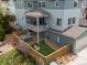 A great backyard with synthetic lawn, hot tub, privacy fence, and outdoor seating at 3368 Cranston Cir, Highlands Ranch, CO 80126