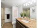 Bathroom featuring a granite vanity, tile floors, and a glass-enclosed shower at 3368 Cranston Cir, Highlands Ranch, CO 80126