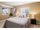 Cozy bedroom with great natural light, large window, and stylish furnishings at 3368 Cranston Cir, Highlands Ranch, CO 80126