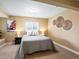 Cozy bedroom features a comfortable bed, neutral color palette, and ample natural light from the window at 3368 Cranston Cir, Highlands Ranch, CO 80126