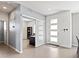Inviting entryway featuring sleek tile flooring, a sliding glass door, and a modern front door with glass panels at 3368 Cranston Cir, Highlands Ranch, CO 80126