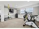 Exercise room with carpet flooring and a variety of fitness equipment at 3368 Cranston Cir, Highlands Ranch, CO 80126