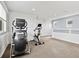 Bright exercise room with fitness equipment and neutral carpet flooring at 3368 Cranston Cir, Highlands Ranch, CO 80126
