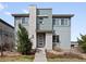 Contemporary two-story home featuring stone accents, modern siding, and a well-manicured front yard at 3368 Cranston Cir, Highlands Ranch, CO 80126