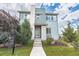 Charming two-story home with a well-manicured lawn and inviting stone-accented entrance at 3368 Cranston Cir, Highlands Ranch, CO 80126
