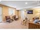 Cozy living room with neutral carpet, stylish seating, and bright, recessed lighting at 3368 Cranston Cir, Highlands Ranch, CO 80126