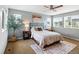 Bright bedroom with natural light, a ceiling fan, and ample closet space at 3368 Cranston Cir, Highlands Ranch, CO 80126