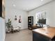 Bright office space with a large window, comfortable chair, stylish decor and a wooden desk at 3368 Cranston Cir, Highlands Ranch, CO 80126