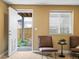 Inviting sitting area with natural light streaming in from the window overlooking the private yard at 3368 Cranston Cir, Highlands Ranch, CO 80126