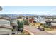 Neighborhood street view showcasing well-maintained homes, landscaping, and a glimpse of distant mountains at 3368 Cranston Cir, Highlands Ranch, CO 80126