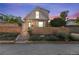 Charming brick home featuring a brick facade, landscaped front yard, and traditional architectural details at 824 E Iowa Ave, Denver, CO 80210