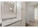 Clean bathroom with a vanity, mirror, and storage at 740 N Pearl St # 203, Denver, CO 80203