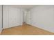 Bright bedroom with double door closet and wood-look flooring at 740 N Pearl St # 203, Denver, CO 80203