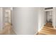 Clean hallway with tile and wood floors, leading to bedrooms and bathroom at 740 N Pearl St # 203, Denver, CO 80203