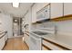 Bright kitchen with white cabinets, modern appliances, and ample counter space at 740 N Pearl St # 203, Denver, CO 80203