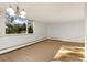 Living room with large window, wood floors, and a chandelier at 740 N Pearl St # 203, Denver, CO 80203