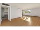 Spacious living room with wood-look floors and large window at 740 N Pearl St # 203, Denver, CO 80203