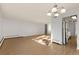 Open-concept living room with hardwood floors, neutral walls, and recessed lighting adjacent to the kitchen at 740 N Pearl St # 203, Denver, CO 80203
