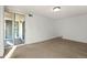 Bright living room with wood floors and sliding glass door to balcony at 740 N Pearl St # 203, Denver, CO 80203