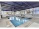 Indoor swimming pool with a blue metal ceiling, lots of natural light and a tiled floor at 740 N Pearl St # 203, Denver, CO 80203