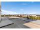 Spacious roof deck with lounging chairs offers panoramic city views and outdoor relaxation at 740 N Pearl St # 203, Denver, CO 80203