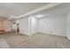 Spacious unfinished basement with carpet flooring at 1906 S Vrain St, Denver, CO 80219